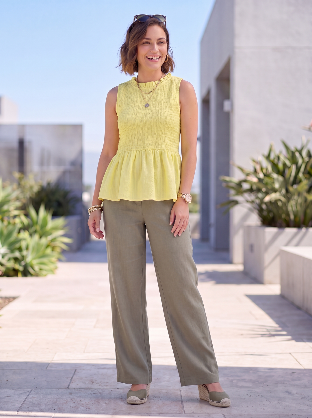 “FRANCES” Sleeveless Shirred Peplum Top