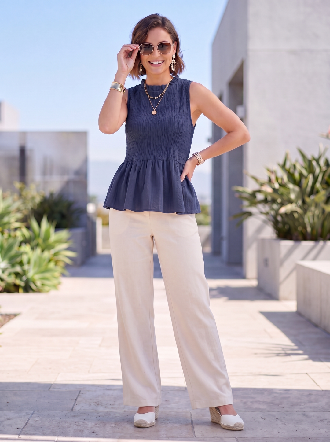 “FRANCES” Sleeveless Shirred Peplum Top