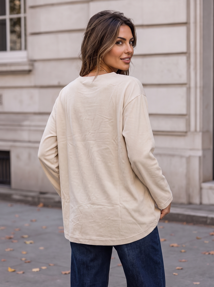 “KENZIE Collection” Eyelet Detail Dipped Hem Sweat Top cream
